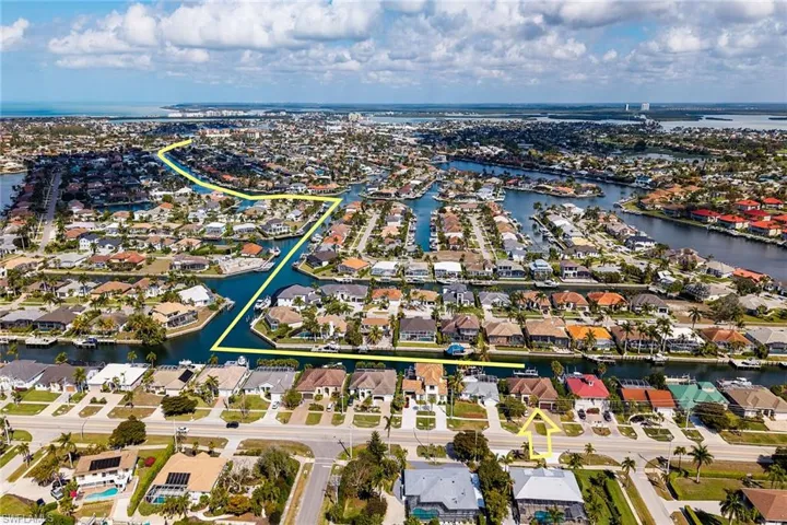 Full bath featuring vanity, combined bath / shower with glass door, and recessed lighting