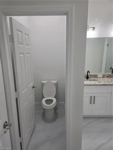 Bathroom featuring toilet and vanity
