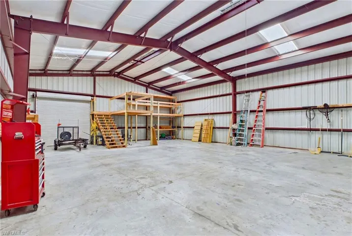 Inside view of 40' x 50' red steel building—ideal for RVs, equipment, vehicles, and much more.