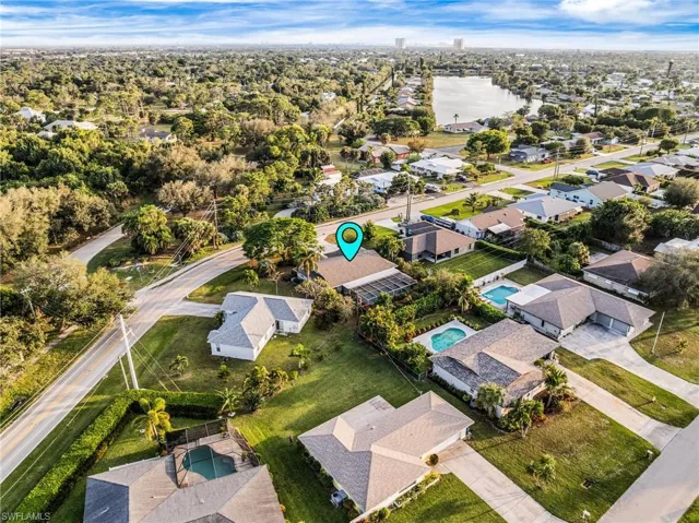 Aerial overview of property's location featuring nearby suburban area