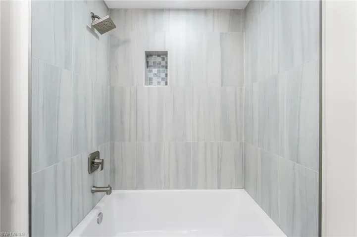 Guest Full bath featuring shower / tub combination