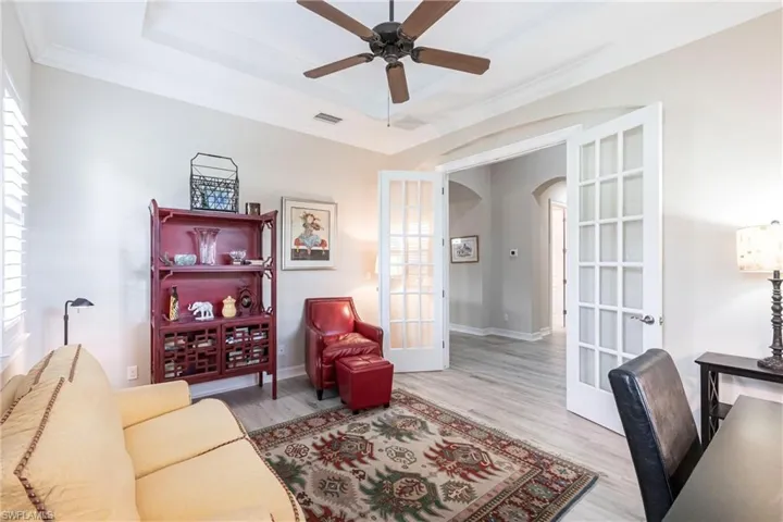 Spacious Den with NEW flooring, french doors, plenty of sunlight and can be used as a Flex area.