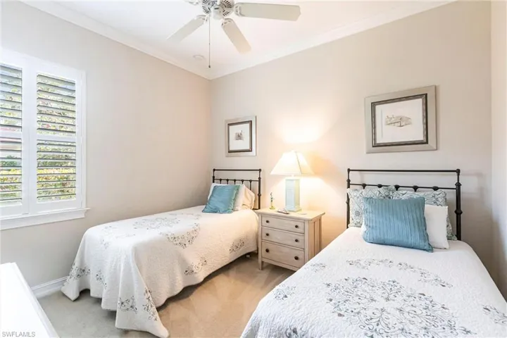 3rd Bedroom featuring ceiling fan, ornamental molding, and light carpet