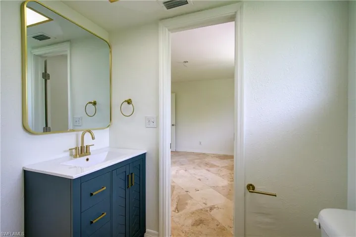 Bathroom featuring toilet and vanity