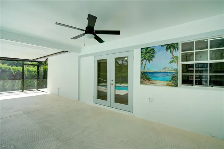 Unfurnished sunroom with french doors