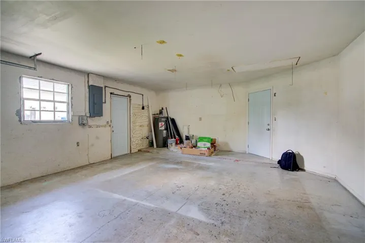 Garage with electric water heater and electric panel