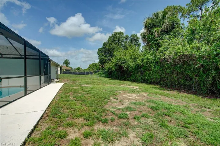 View of yard featuring a lanai