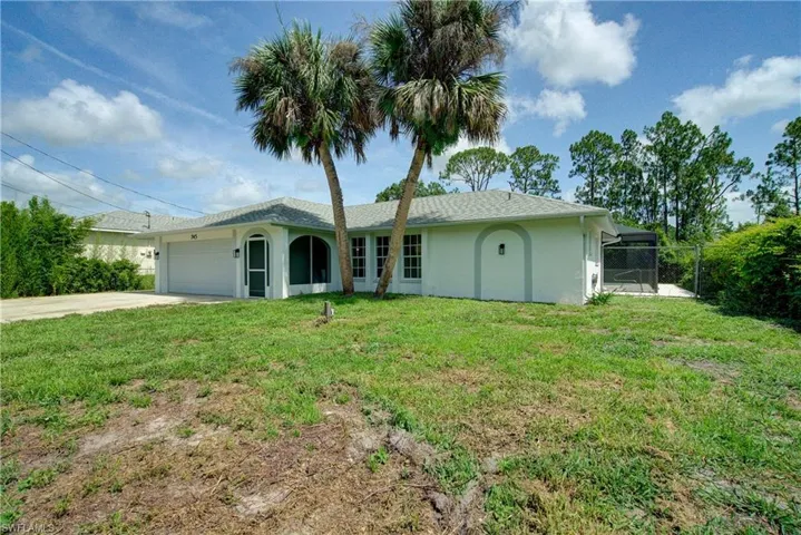 Ranch-style home with a garage, stucco siding, and concrete driveway