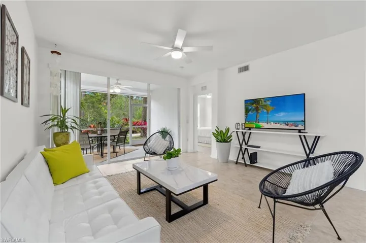 Living room featuring ceiling fan