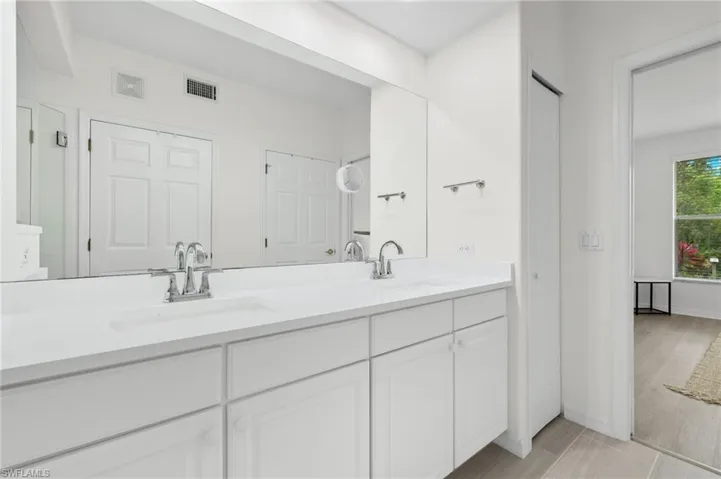 Bathroom featuring hardwood / wood-style floors and vanity