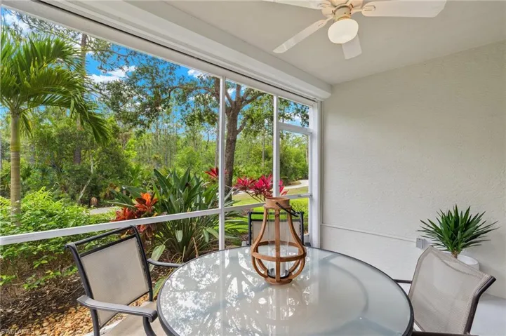Sunroom / solarium featuring ceiling fan
