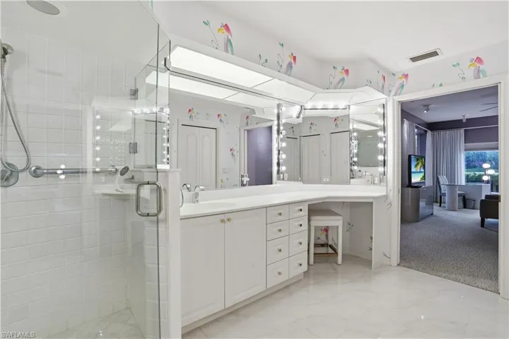 Ensuite bathroom with walk in shower and vanity area.