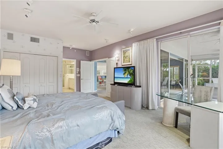 Primary bedroom with lanai access.