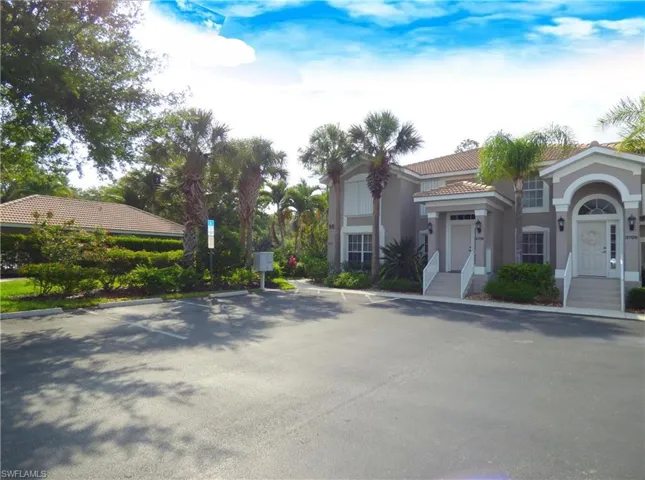 The Condo Building Is Right Next To The Pool
