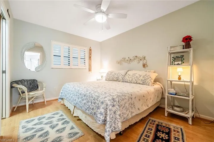 Bedroom featuring hardwood / wood-style floors and ceiling fan