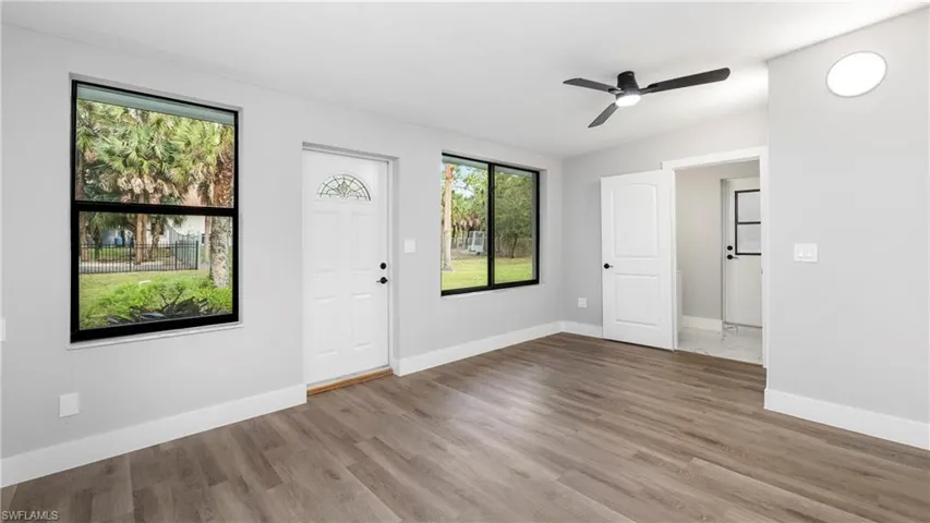 Entrance foyer featuring wood finished floors and ceiling fan