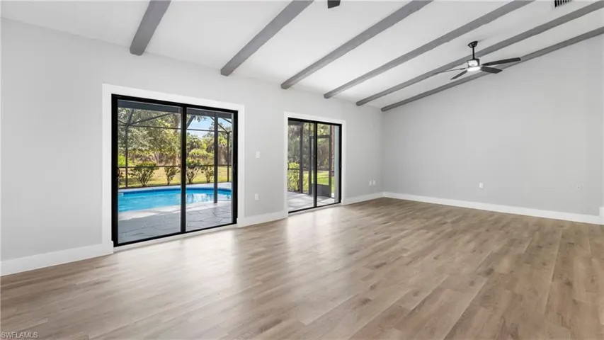 Spare room with light wood-style flooring and baseboards