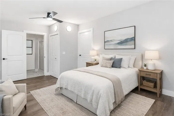 Virtually Staged Bedroom featuring ceiling fan, dark wood-style flooring, and a closet