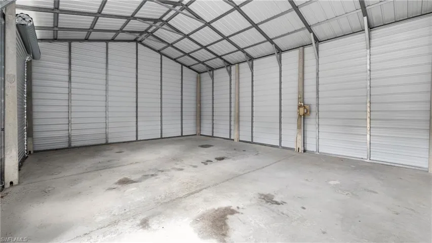 Garage featuring metal wall