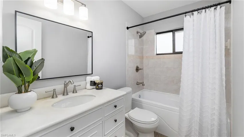 Full bathroom with vanity and shower / tub combo