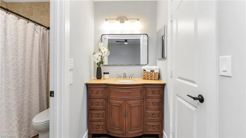 Full bathroom featuring vanity and a shower with curtain