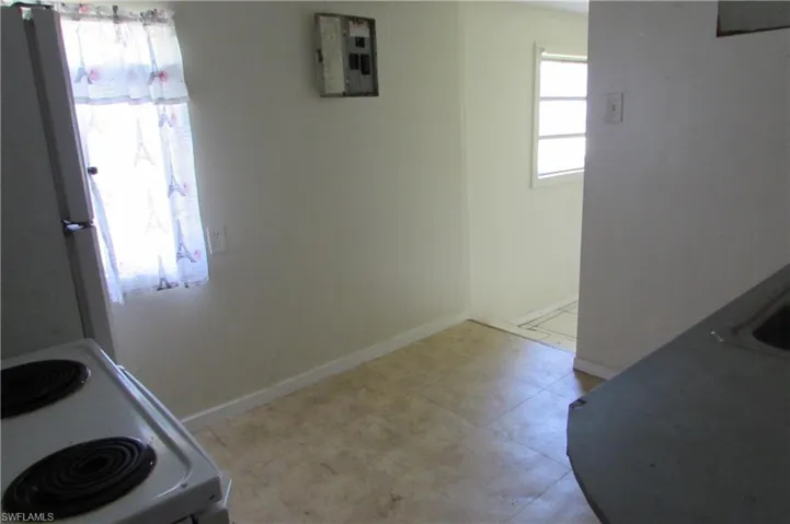 Kitchen with light tile patterned floors
