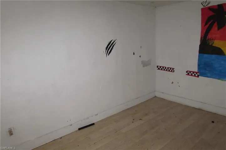 Unfurnished room with light hardwood / wood-style floors