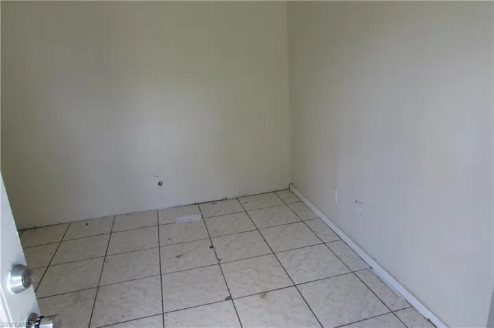 Spare room featuring light tile patterned floors