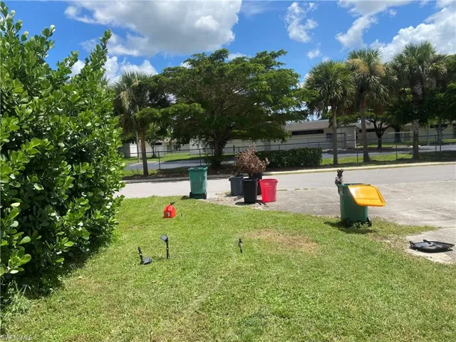 View of property's community featuring a yard