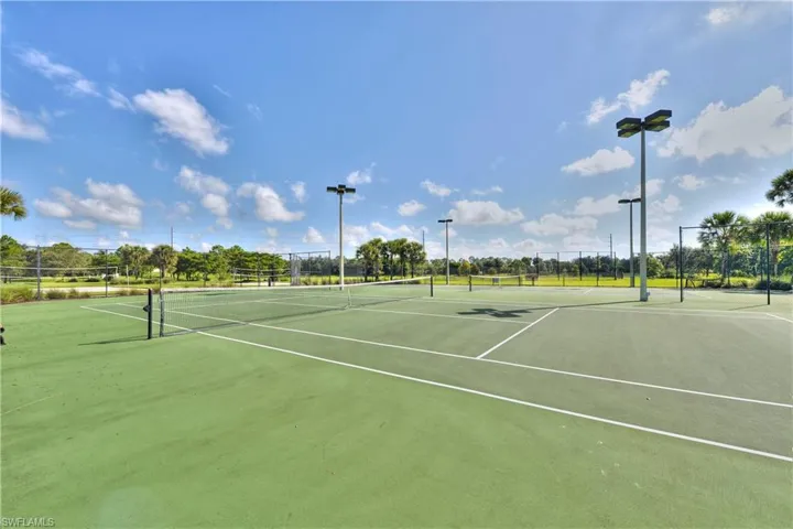 View of tennis court with community basketball court