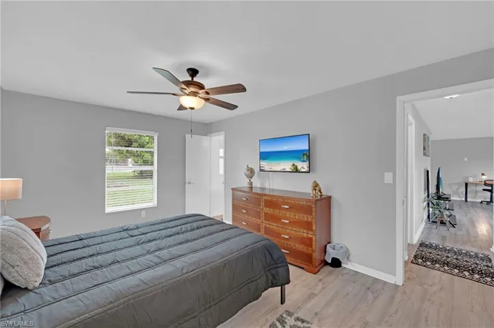 Bedroom featuring wood finished floors and a ceiling fan