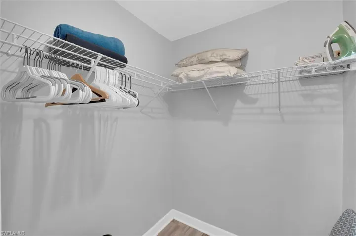 Walk in closet featuring light wood-style floors