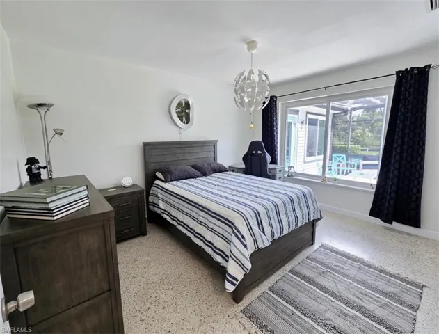 Bedroom with an inviting chandelier