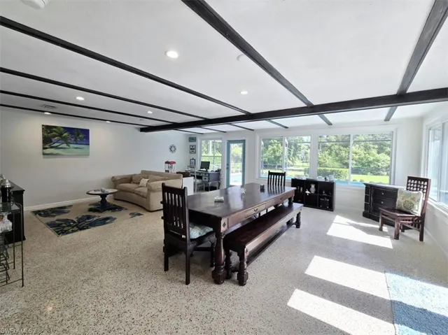 Dining space with beamed ceiling