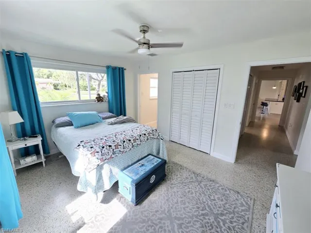Bedroom featuring ceiling fan and a closet