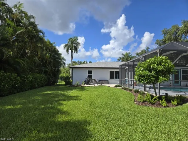 View of yard featuring a lanai and a patio area