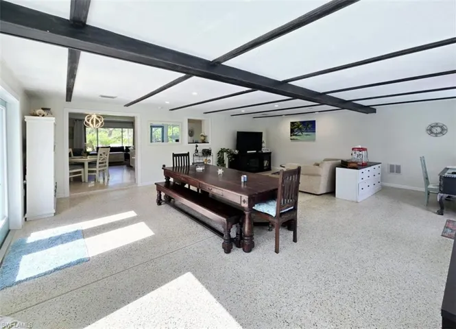 Living room with beamed ceiling