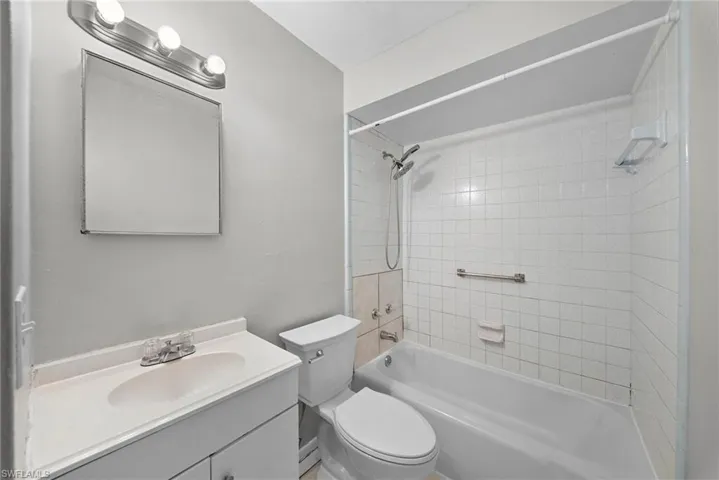 Bathroom with vanity and tub / shower combination