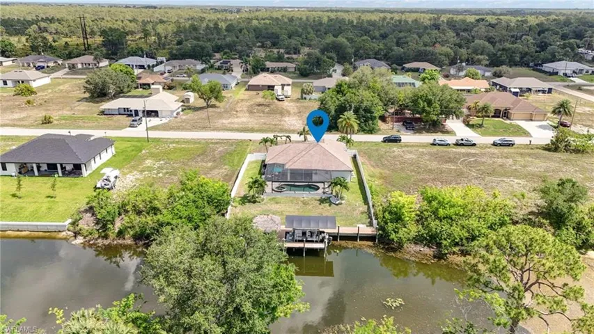 Aerial view of residential area with a large body of water