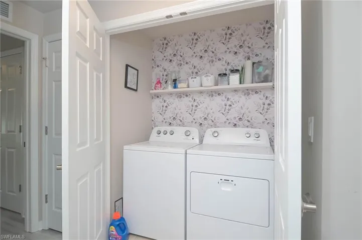 Washroom with washing machine and dryer