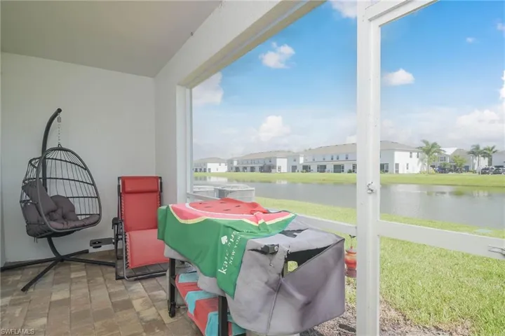 Sunroom with a water view and plenty of natural light