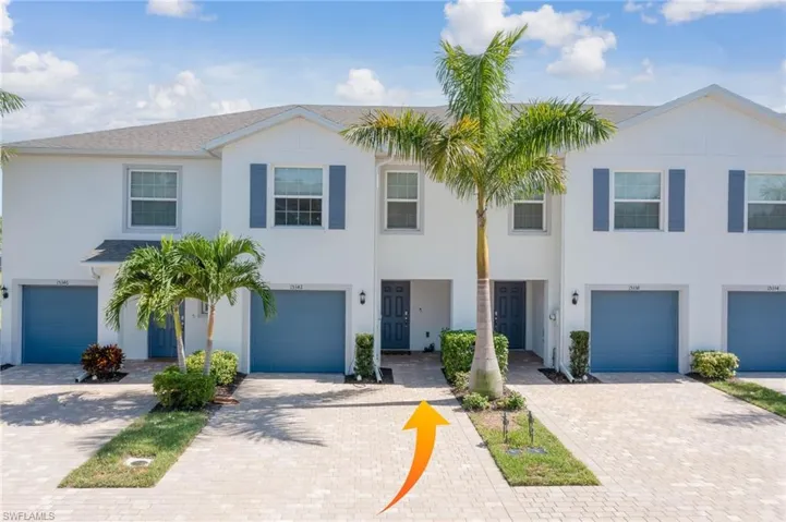 View of property featuring a garage