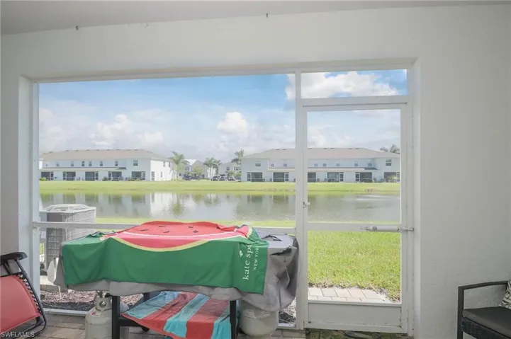 Sunroom with a healthy amount of sunlight and a water view