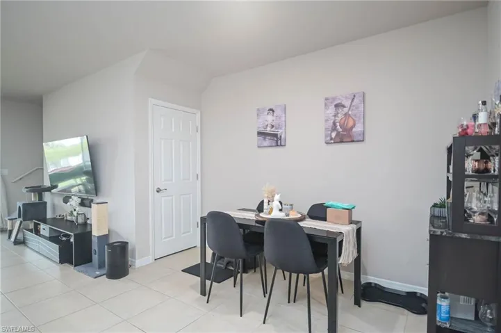 Dining room featuring light tile patterned floors