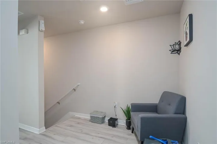 Sitting room with light hardwood / wood-style floors