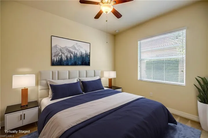 Bedroom featuring baseboards and ceiling fan