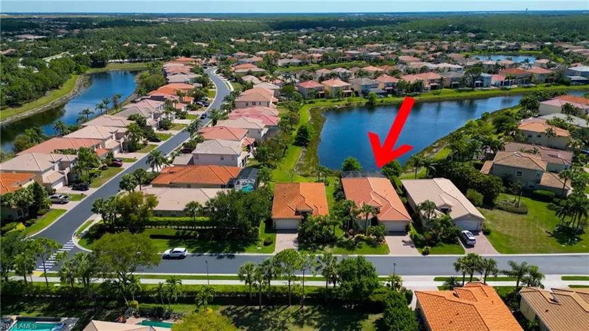 Aerial view featuring a residential view and a water view