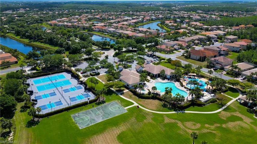 Aerial view featuring a residential view and a water view