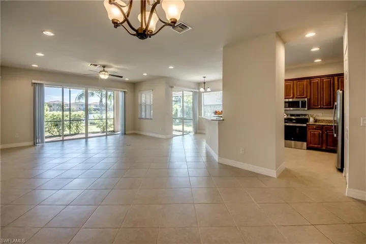 Empty room featuring baseboards, visible vents, and recessed lighting