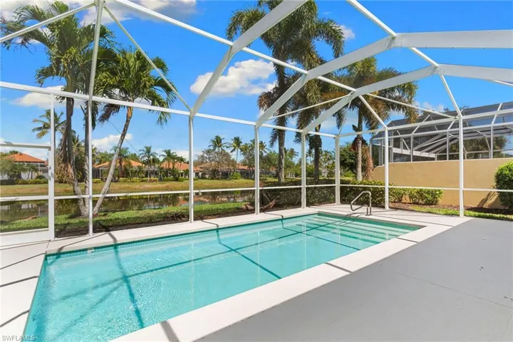 Outdoor pool with a lanai, a patio, and a sunroom